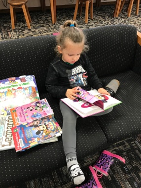 Went to the library on my morning off (because that's what you do...go back to work when you're supposed to be off, right?). She kicked off her shoes and started reading. My heart was happy.
